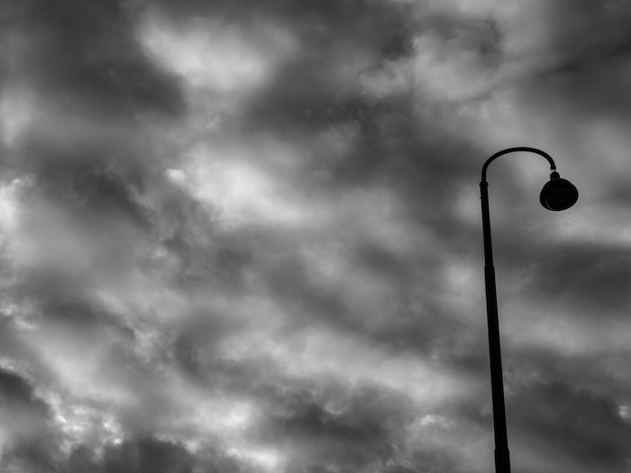Street lamp with clouds in Vienna photographed by Astrid Julen.
